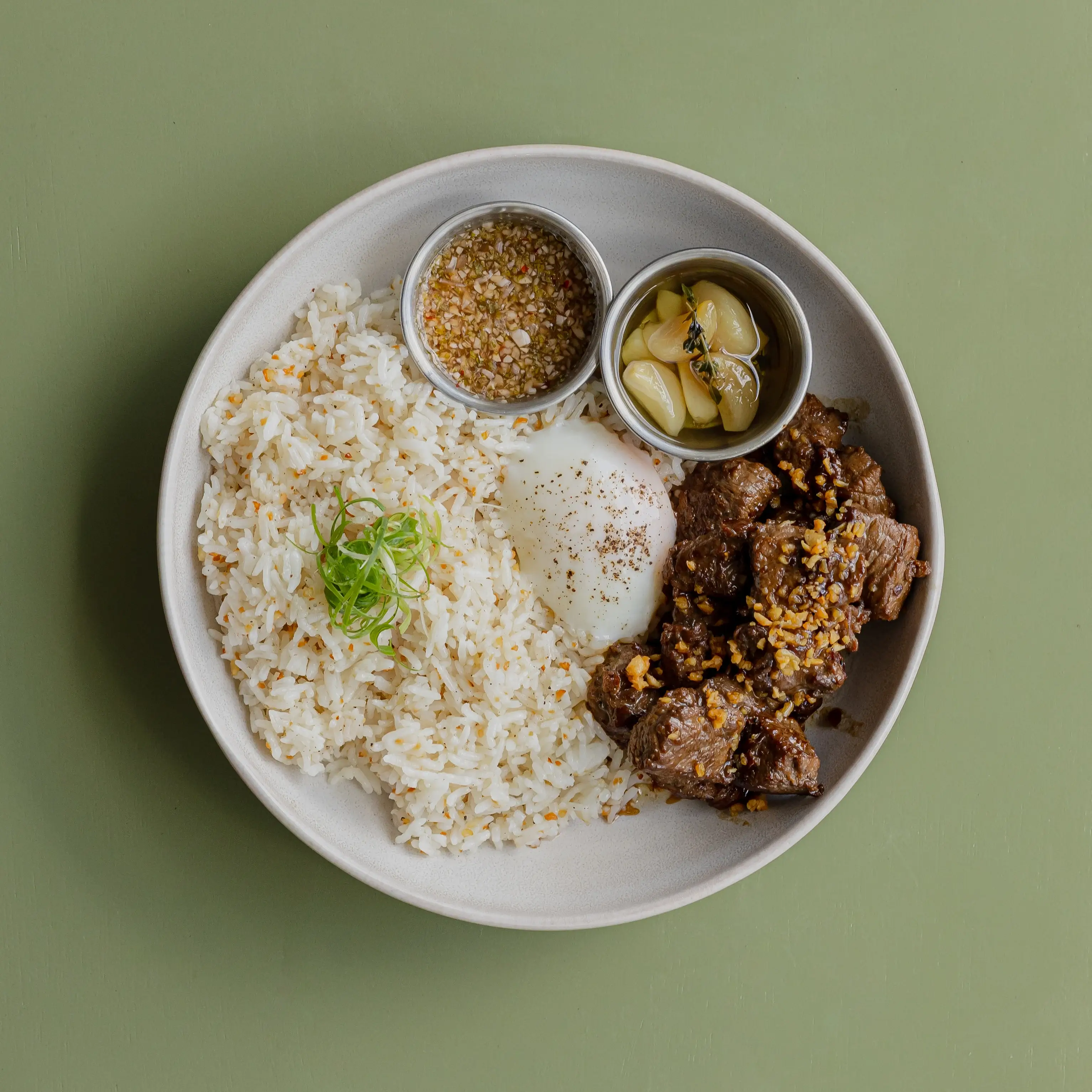 Classic beef tapa, garlic fried rice, 63 degree onsen egg, garlic confit, crack sauce